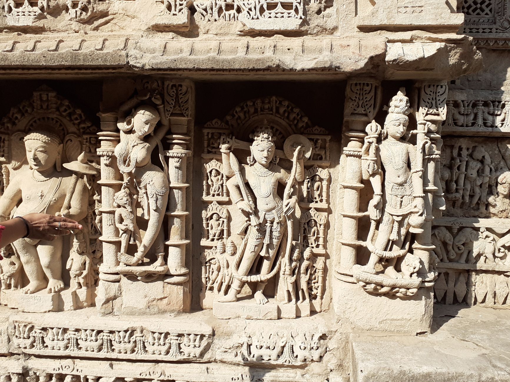 Detailed stone sculptures at Rani Ki Vav in Patan, Gujarat, showcasing Hindu deities and artistry.