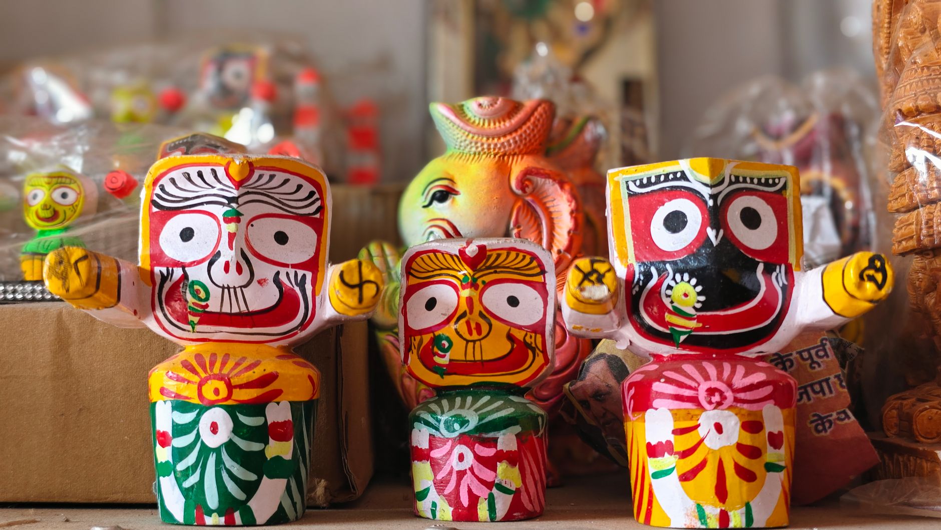 Vibrant painted wooden figurines showcasing traditional Indian art and culture.